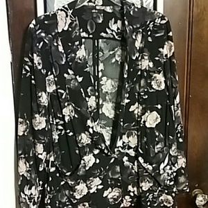 Black blazer with pink and white flowers.